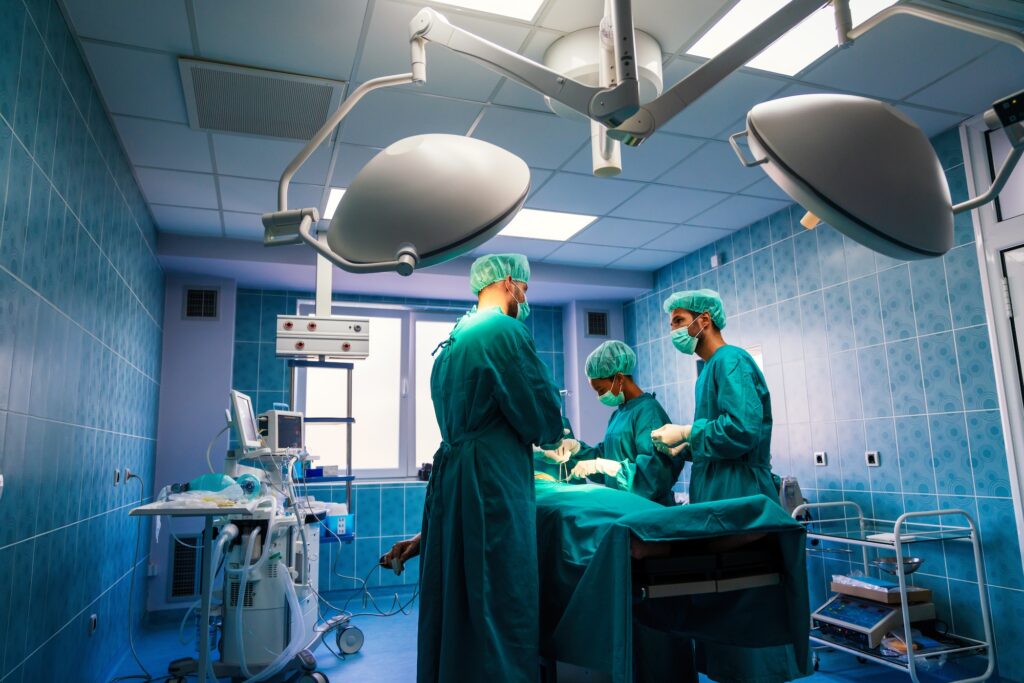 Surgery team operating in a surgical room